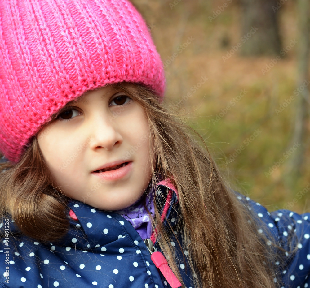 Portrait of a girl in a cap.