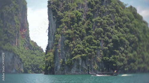 Longtail Boat in Chiew Lan Lake, Trip Khao Sok area, Thailand. jungle forest photo