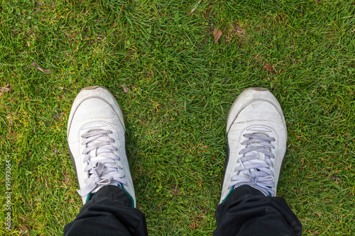 men old shoes on grasses