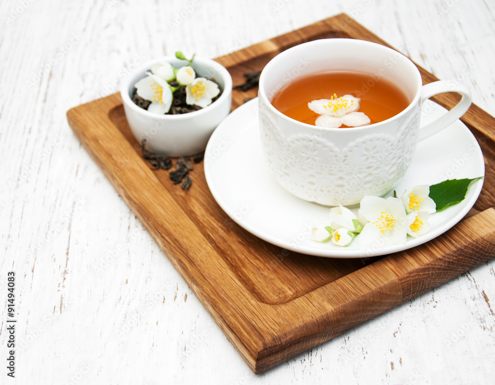 Cup of tea with jasmine flowers Cup of tea with jasmine flowers
