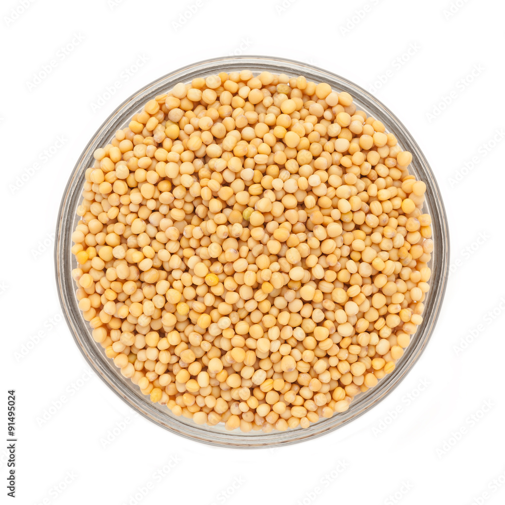 Top view of Organic yellow mustard (Brassica alba) in glass bowl isolated on white background. Top view of Organic yellow mustard (Brassica alba) in glass bowl isolated on white background.