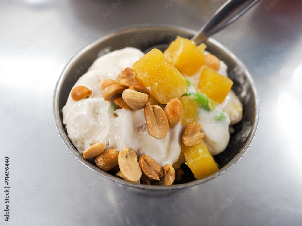 Ice cream sprinkled with peanuts and coconut milk it. Ice cream sprinkled with peanuts and coconut milk it.