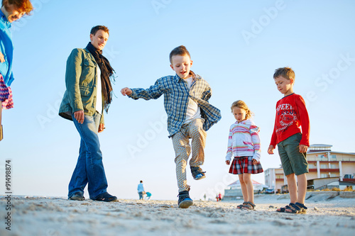 boy on the sea beach photo