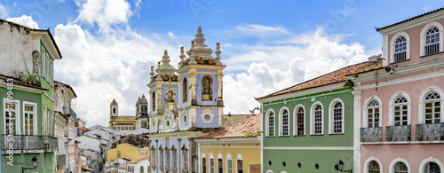 Facades of the old houses and townhouses and towers of historic churches in Pelourinho neighborhood in Salvador, Bahia photo