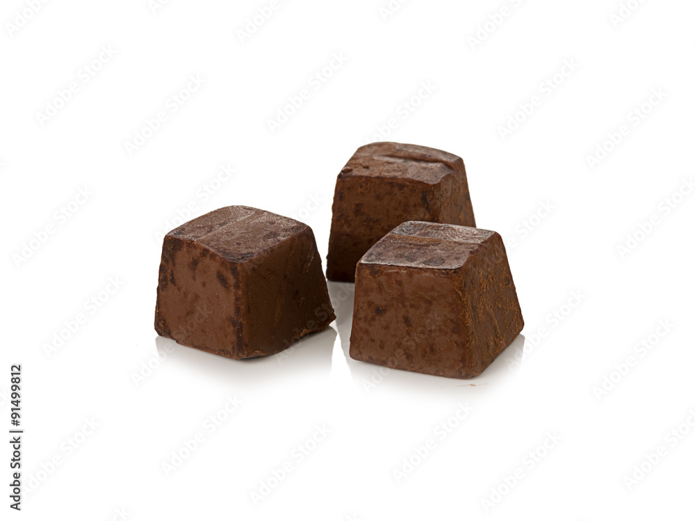 Chocolate pieces on white background Chocolate pieces on white background