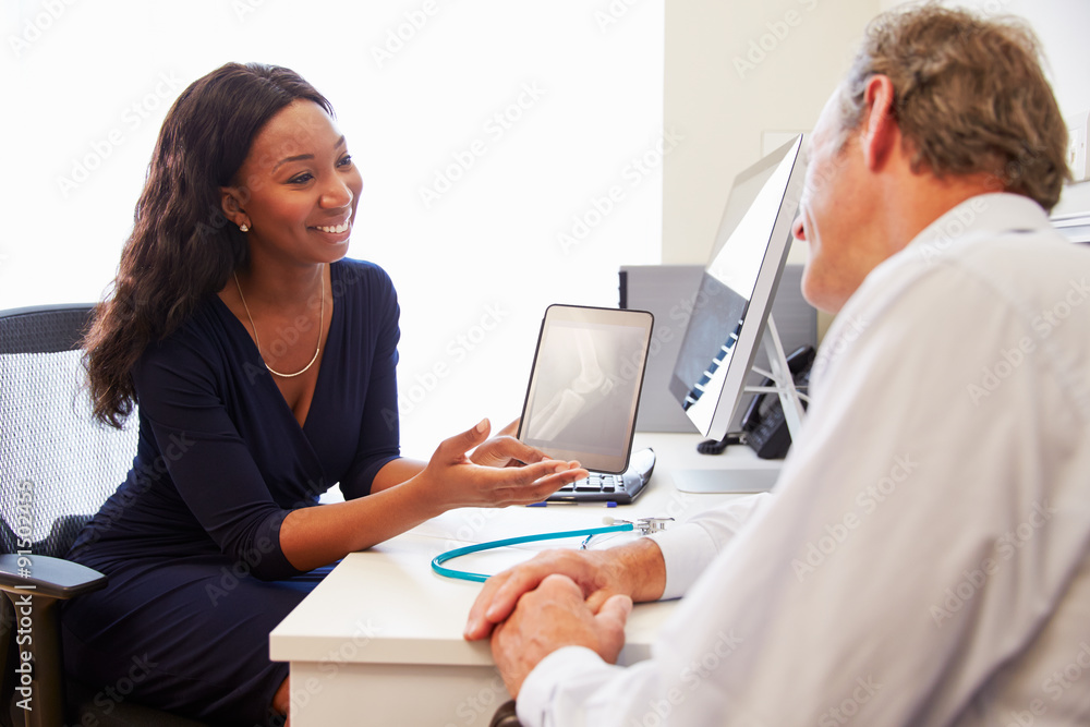 Patient Having Consultation With Female Doctor In Office