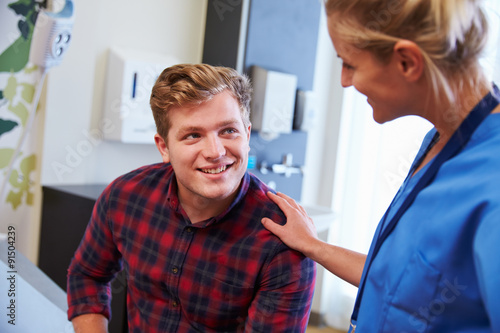 Wallpaper Mural Male Patient Being Reassured By Nurse In Hospital Room Torontodigital.ca