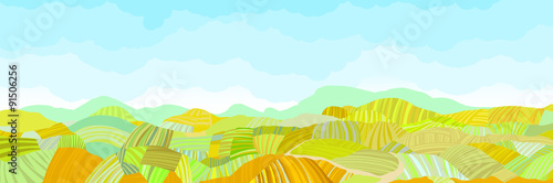 Horizontal panorama of colorful autumn fields and sky.
