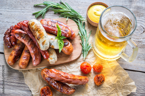 Grilled sausages with glass of beer