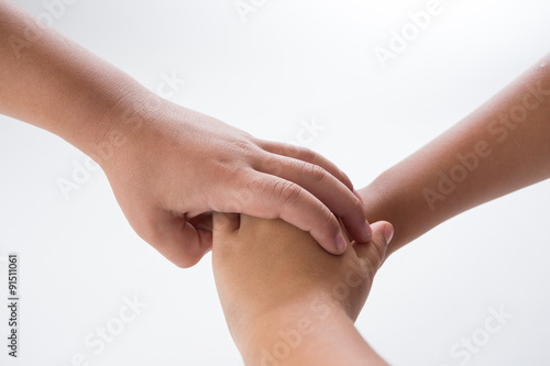 Group handshake on white background.