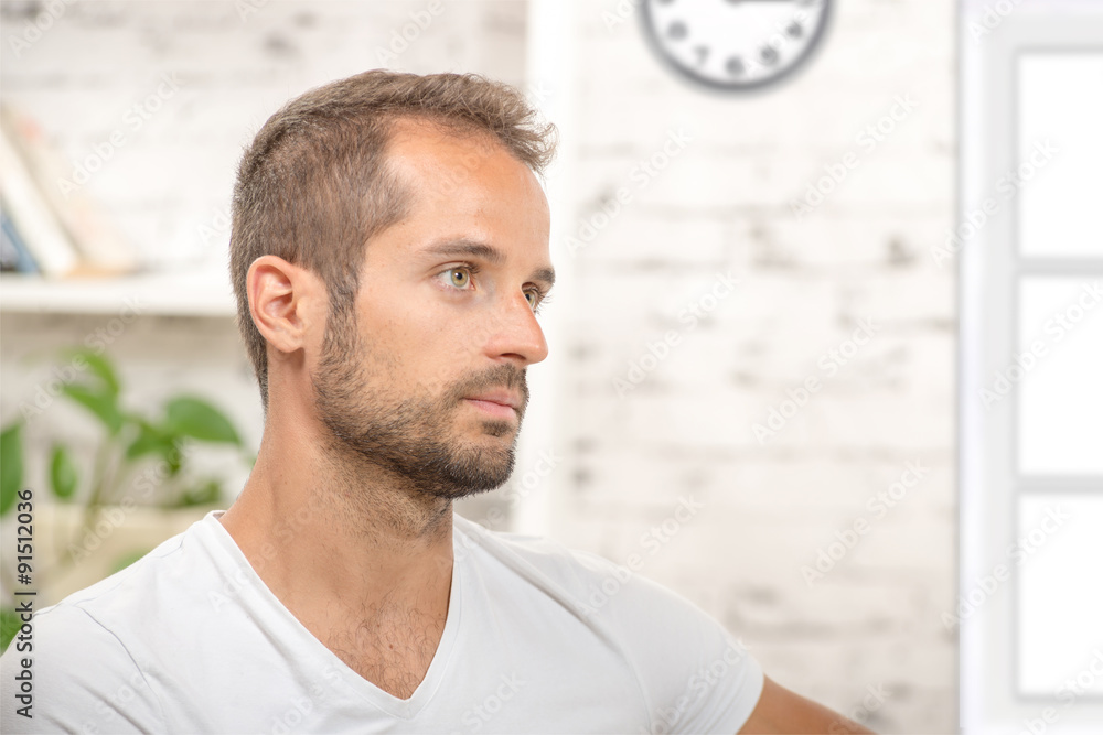 portrait of a young businessman in his office portrait of a young businessman in his office