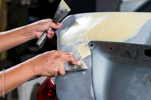 Billede på lærred Car paint repair series : Working on putty
