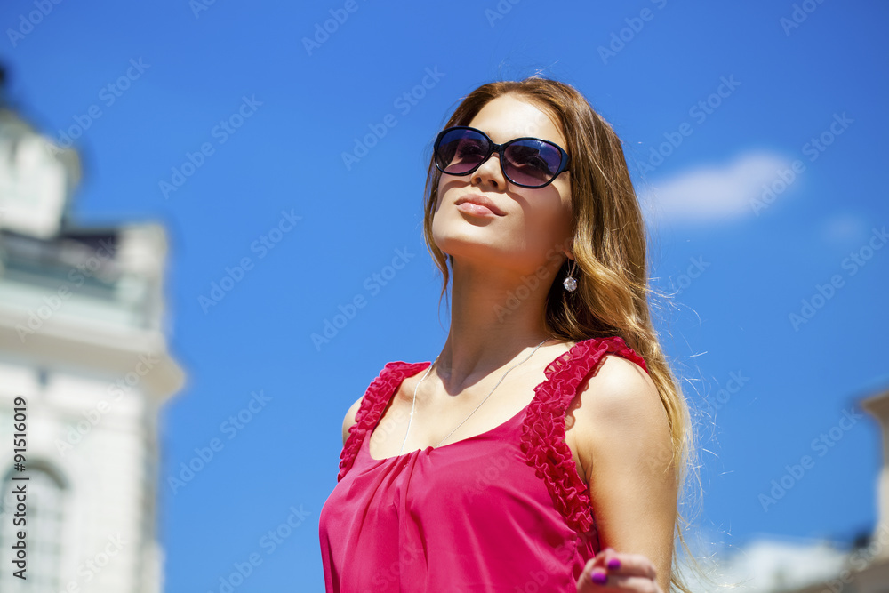 Charming blonde girl in sunglasses