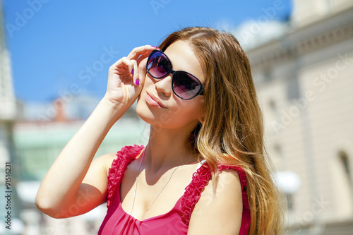 Charming blonde girl in sunglasses