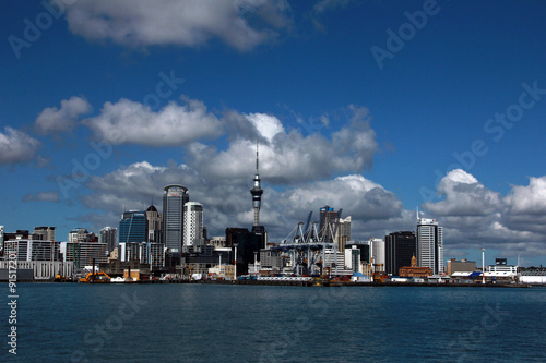 Auckland, New Zealand - the largest and most populous urban area in the country, view of the city from the water on a bright sunny day with cumulus clouds in the sky © proxima13