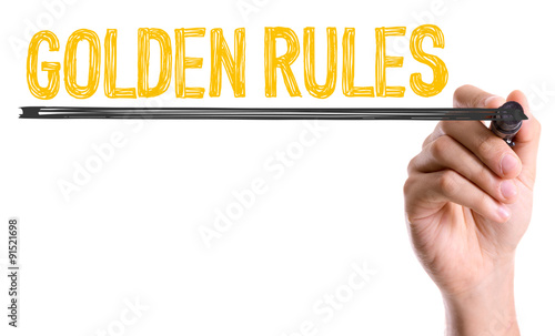 Fotografie Hand with marker writing: Golden Rules
