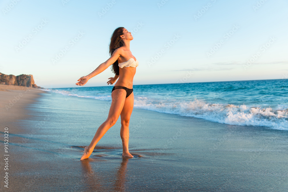 Relaxation relief celebrating freedom conceptual beautiful beach sunset woman perfect body fitness shape