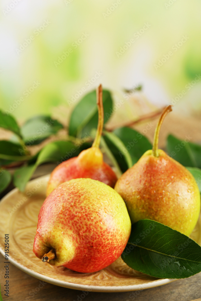 Fresh pears on wooden table on blurred background Fresh pears on wooden table on blurred background