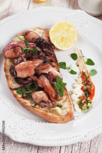 Grilled squid on toasted bread