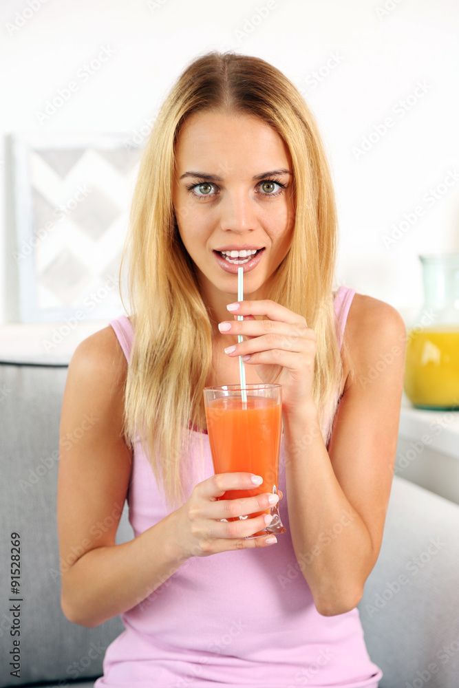 Young beautiful woman drinking fresh juice Young beautiful woman drinking fresh juice