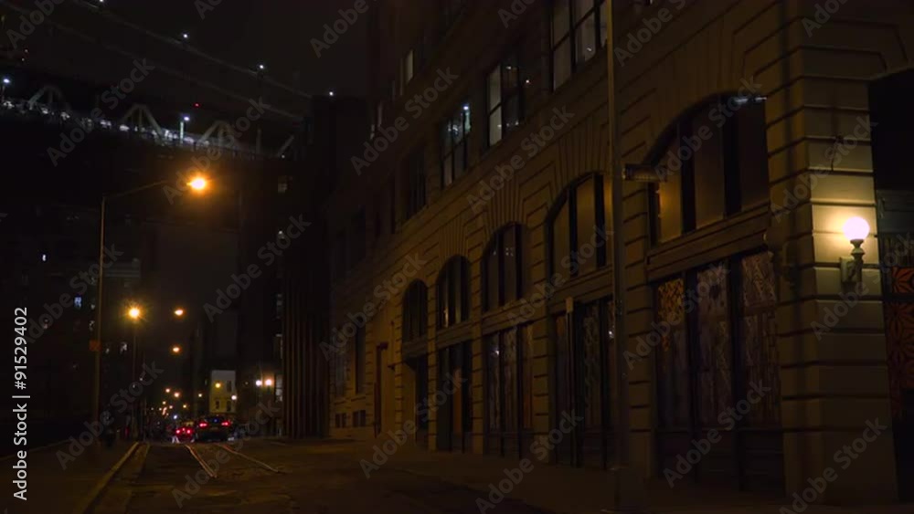 Establishing shot of warehouses under the Brooklyn Bridge with subway train crossing. Establishing shot of warehouses under the Brooklyn Bridge with subway train crossing.