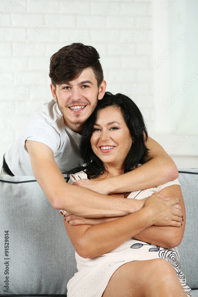 Portrait of mother and her son on sofa at home Portrait of mother and her son on sofa at home