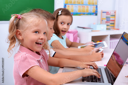 Group of children at laptop...