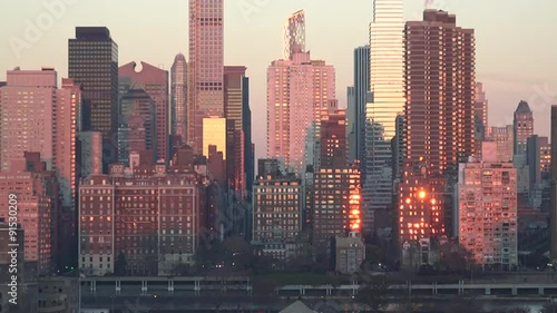 Time lapse shot of sunrise reflected in buildings of Manhattan New York.