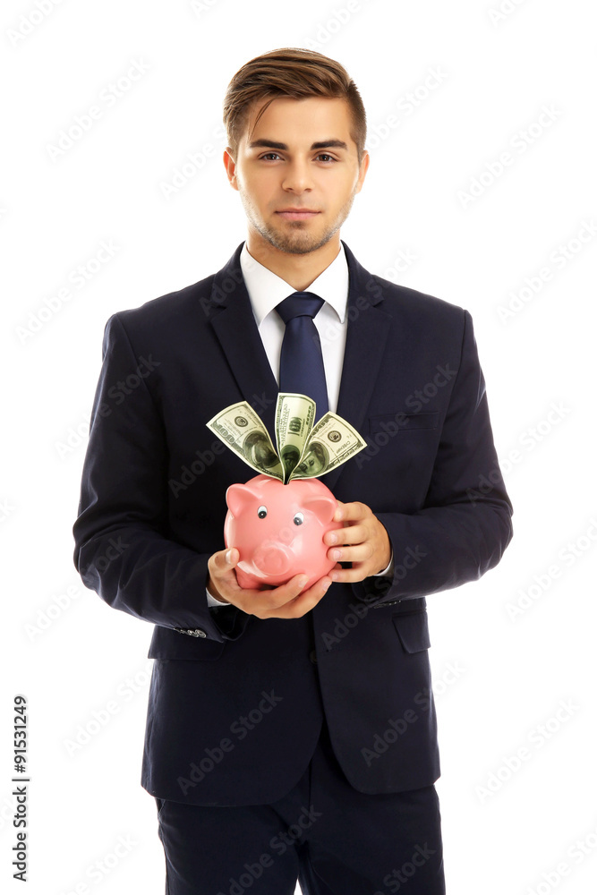 Elegant man holding piggy bank with money isolated on white Elegant man holding piggy bank with money isolated on white