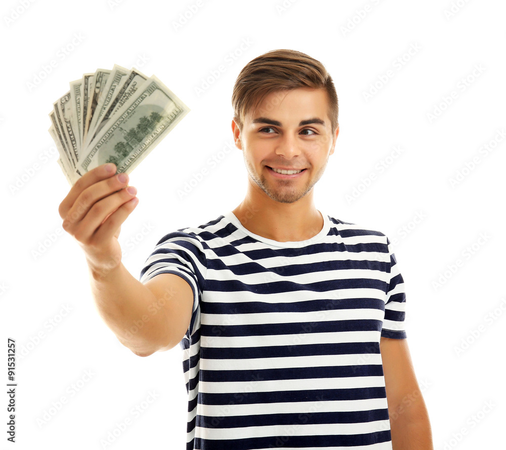 Handsome young man holding money isolated on white Handsome young man holding money isolated on white