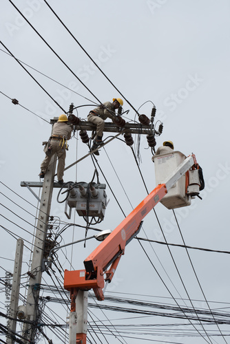 an electrical lineman working on a line
