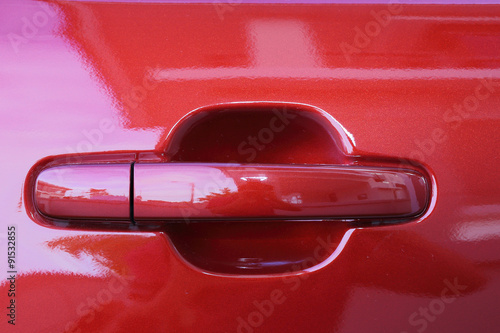 close up of Red car door handle