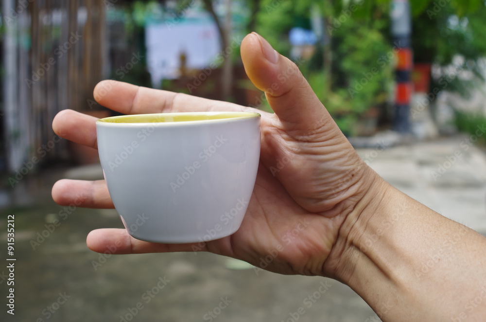 cup to slip out of the hand Stock-Foto | Adobe Stock