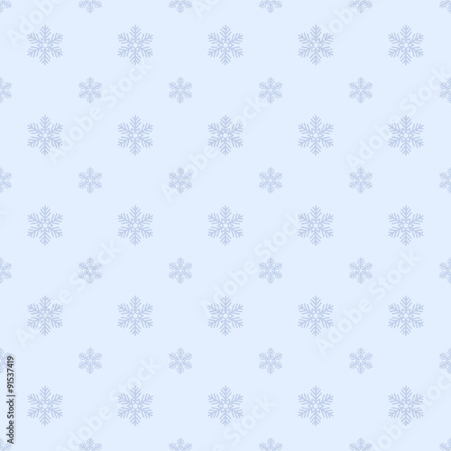 Christmas seamless pattern with snowflakes on a blue background