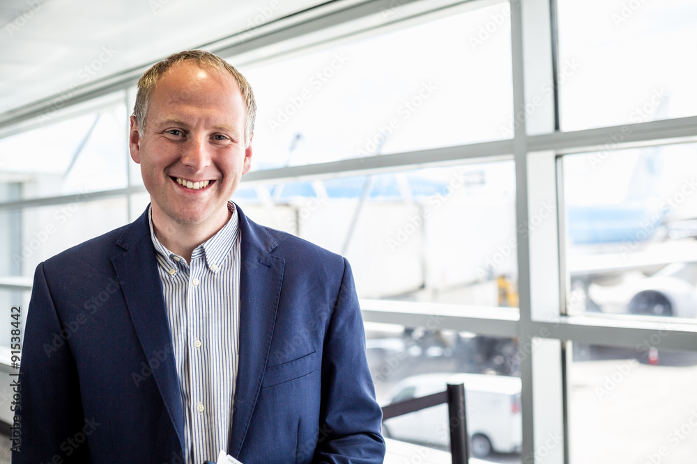 Businessman happy to travel by plane Businessman happy to travel by plane
