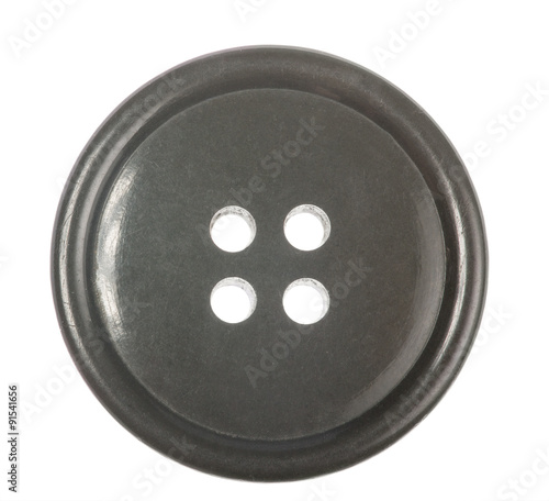 grey single button with four holes isolated on white