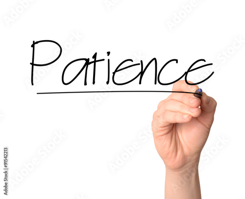 Bild auf Leinwand hand writes the word Patience on the whiteboard with a marker