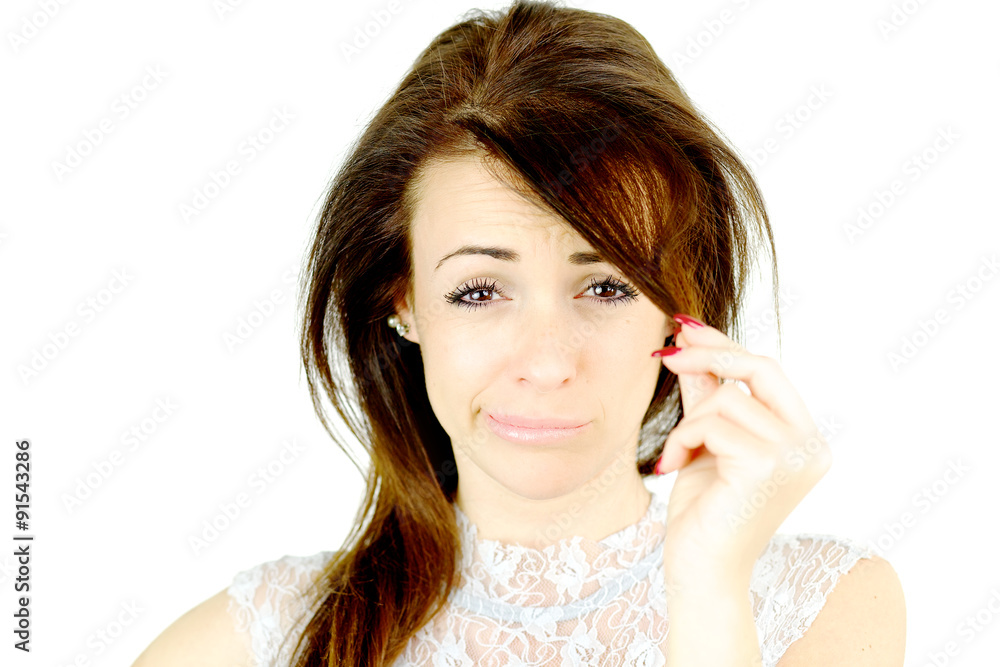 Woman making funny face unhappy about fringe haircut Woman making funny face unhappy about fringe haircut