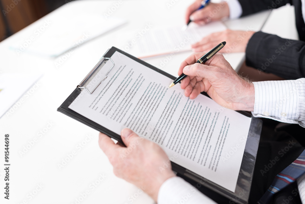 Businesspeople taking notes Businesspeople taking notes