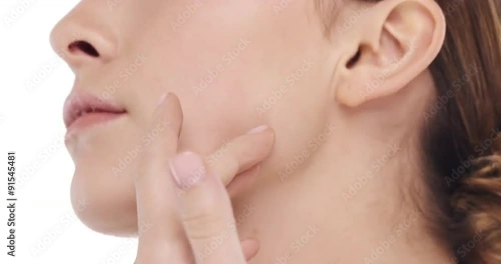 Beauty portrait of woman touching beautiful face in slow motion skincare concept on a white background Beauty portrait of woman touching beautiful face in slow motion skincare concept on a white background