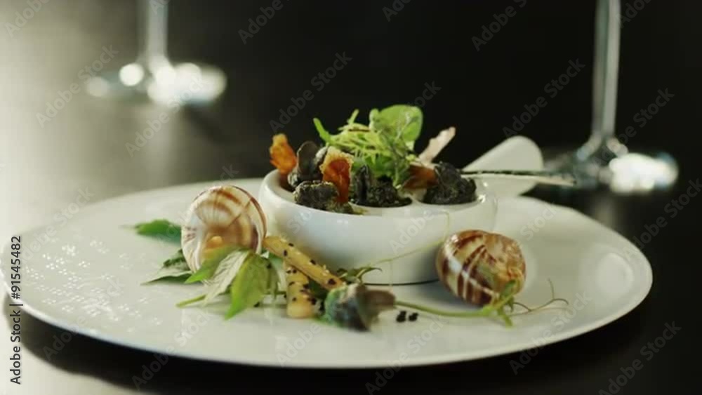 Serving Delicious Baked Escargots in Luxury Restaurant. Serving Delicious Baked Escargots in Luxury Restaurant.