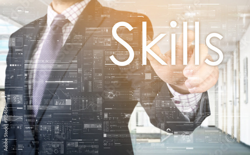 the businessman is choosing Skills from touch screen