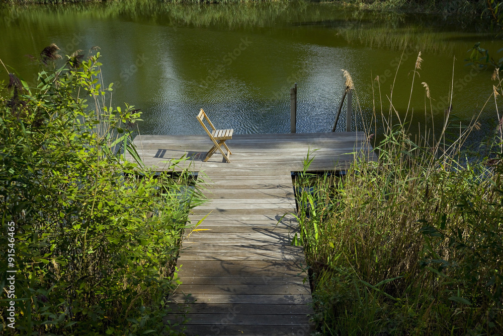 Gartenteich mit Steg StockFoto Adobe Stock