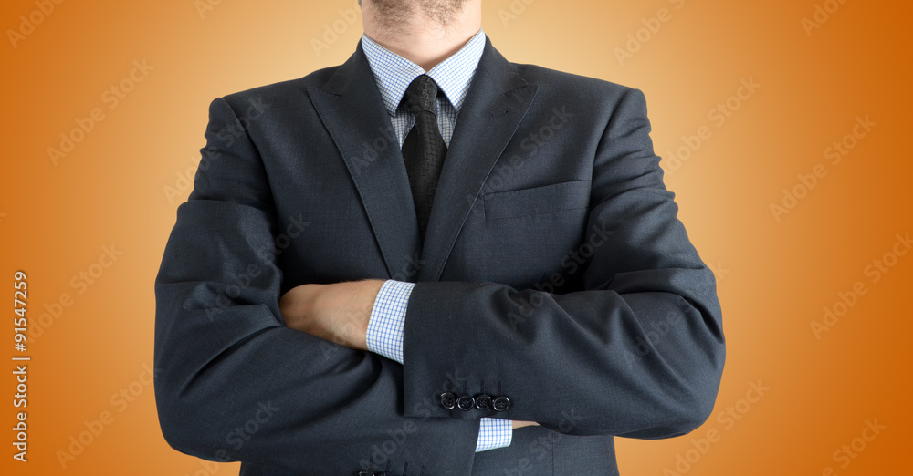 portrait of a successful businessman standing with crossed hands portrait of a successful businessman standing with crossed hands