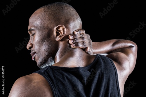 Rear view of muscular man massaging