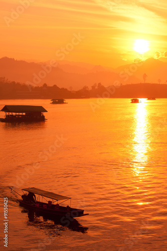 Boat silhouette Sunrise River. © pigprox
