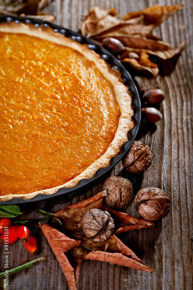 Thanksgiving pumpkin pie on a rustic table
