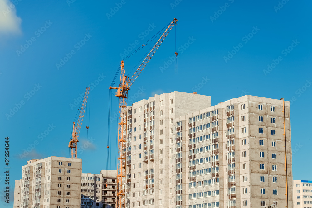 Crane and new residential high-rise buildings Crane and new residential high-rise buildings
