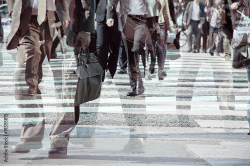 Multiple exposure image of businessman walking