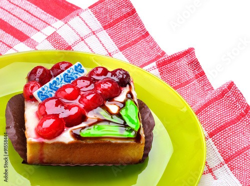 Tart with cherries on the plate